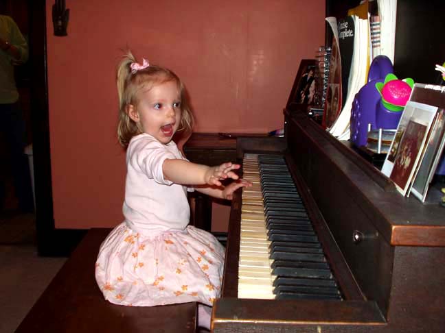 Eva plays piano.Gretchen  Shie Miller 2006.